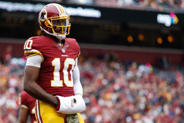 Nov 16, 2014; Landover, MD, USA; Washington Redskins quarterback Robert Griffin III (10) stands on the field against the Tampa Bay Buccaneers at FedEx Field. Mandatory Credit: Geoff Burke-USA TODAY Sports